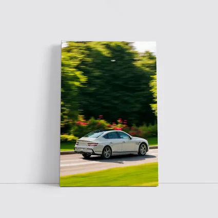 Genesis G80 Sedan Speeding Through Green Park