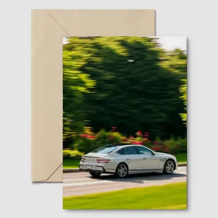 Genesis G80 Sedan Speeding Through Green Park