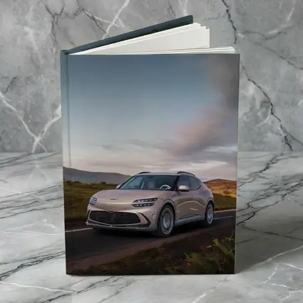 Genesis GV60 SUV on Scenic Highland Road