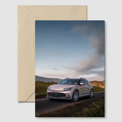 Genesis GV60 SUV on Scenic Highland Road
