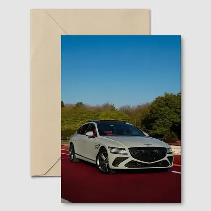 Genesis G80 White Sedan On Red Track