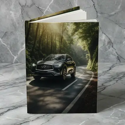 Infiniti QX50 Driving Through Sunlit Forest Road
