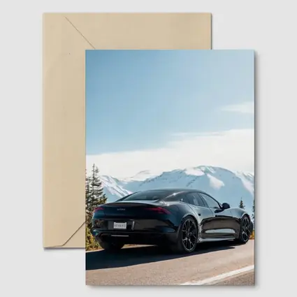 Karma Revero Black Car Snowy Mountain Road