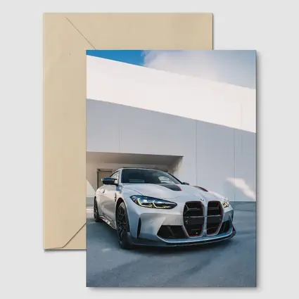 BMW M4 CSL Silver Against White Architecture