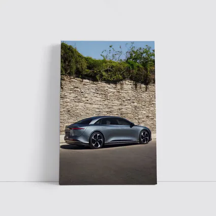 Lucid Air Sedan Parked By Stone Wall