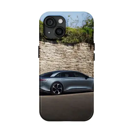 Lucid Air Sedan Parked By Stone Wall