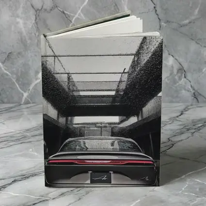 Lucid Air Sedan Rainy Urban Parking Structure