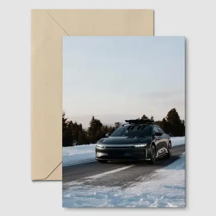 Lucid Air Driving Snowy Winter Road