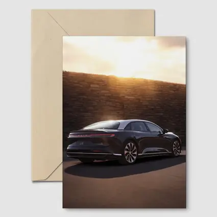 Lucid Air Sedan Parked Against Stone Wall
