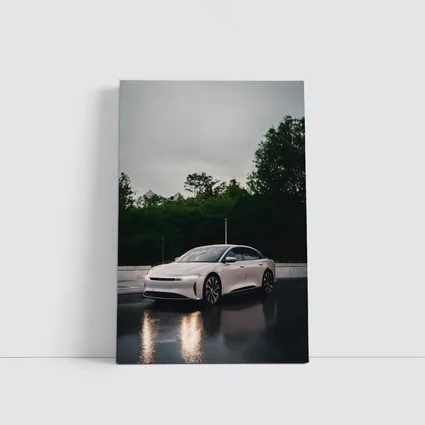 Lucid Air White Sedan Rainy City Street