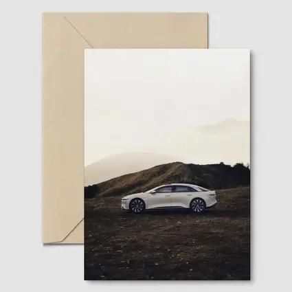 Lucid Air White Sedan Misty Mountain Landscape