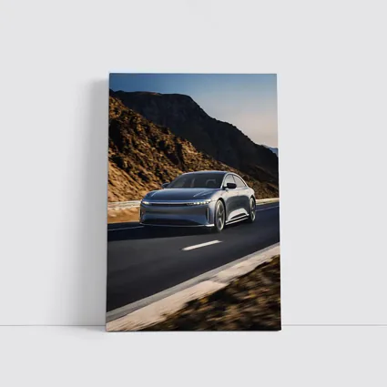 Lucid Air Speeding Through Rocky Mountain Road
