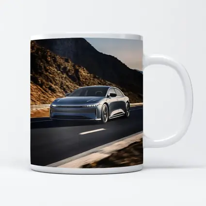 Lucid Air Speeding Through Rocky Mountain Road