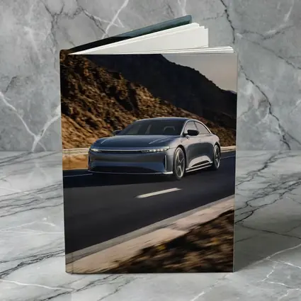 Lucid Air Speeding Through Rocky Mountain Road