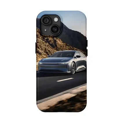 Lucid Air Speeding Through Rocky Mountain Road