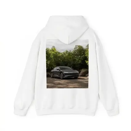 Lucid Air Dark Sedan Parked Among Trees
