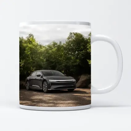 Lucid Air Dark Sedan Parked Among Trees
