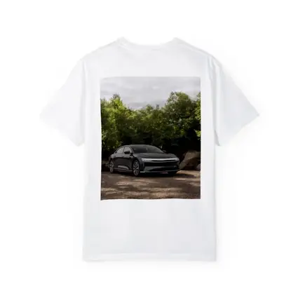 Lucid Air Dark Sedan Parked Among Trees