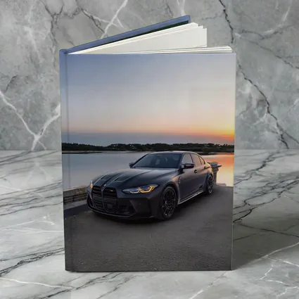 Matte Black BMW M3 Parked By Lake Sunset