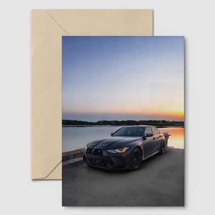 Matte Black BMW M3 Parked By Lake Sunset