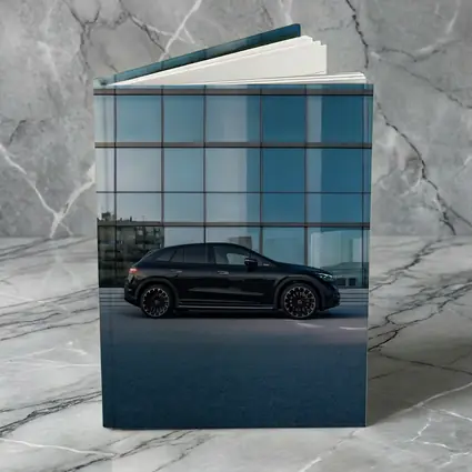 Black Mercedes EQE SUV Glass Building