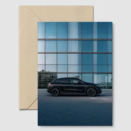 Black Mercedes EQE SUV Glass Building