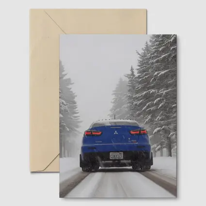 Mitsubishi Lancer Blue Driving Snowy Winter Road