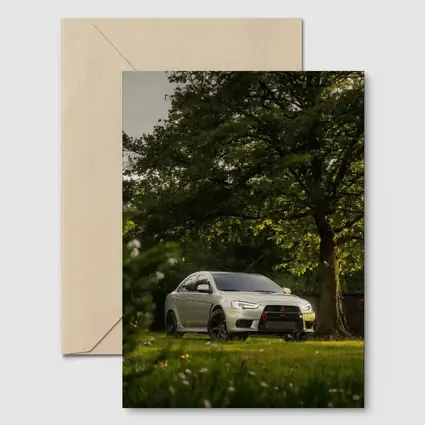 Mitsubishi Lancer Evolution Parked Under Green Trees