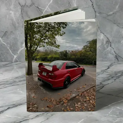 Red Mitsubishi Lancer Evolution Street Parking