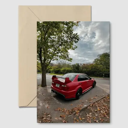 Red Mitsubishi Lancer Evolution Street Parking