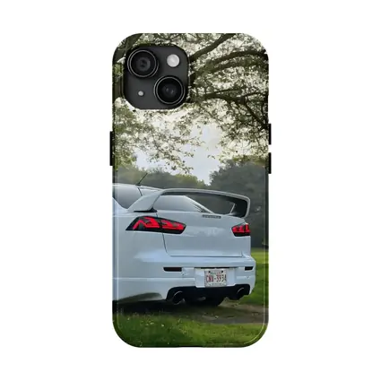 Mitsubishi Lancer White Parked Under Green Trees