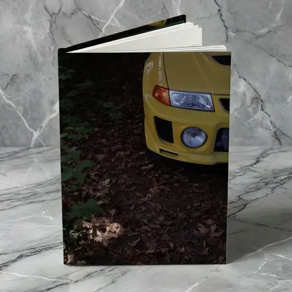 Yellow Mitsubishi Lancer Evolution Forest Trail