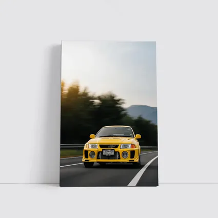 Yellow Mitsubishi Lancer Evolution On Mountain Road