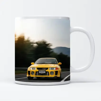 Yellow Mitsubishi Lancer Evolution On Mountain Road