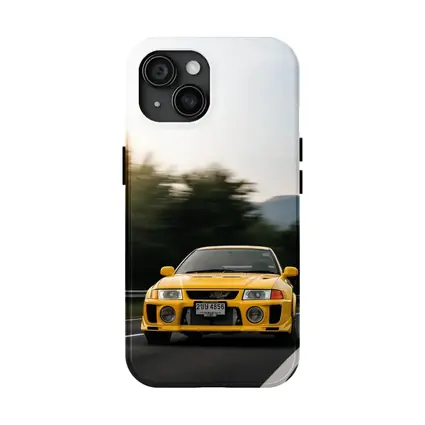 Yellow Mitsubishi Lancer Evolution On Mountain Road