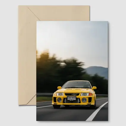 Yellow Mitsubishi Lancer Evolution On Mountain Road