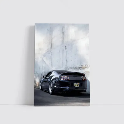Black Ford Mustang Against Concrete Wall