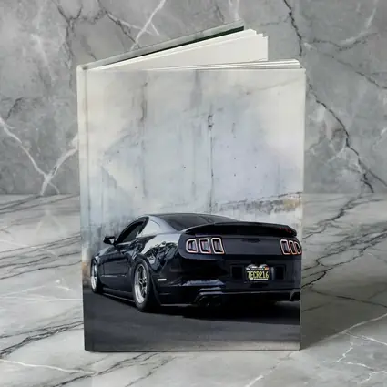 Black Ford Mustang Against Concrete Wall