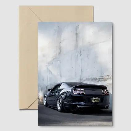 Black Ford Mustang Against Concrete Wall