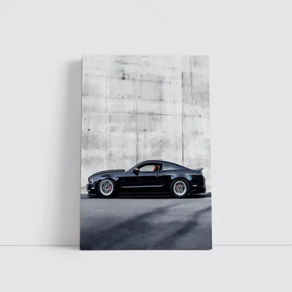 Black Ford Mustang Against Concrete Wall