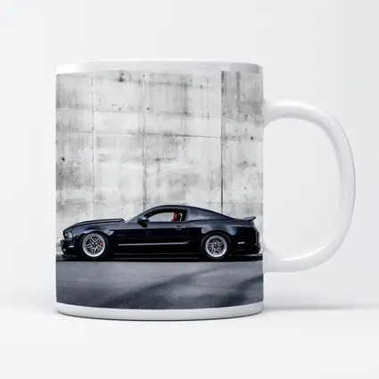 Black Ford Mustang Against Concrete Wall