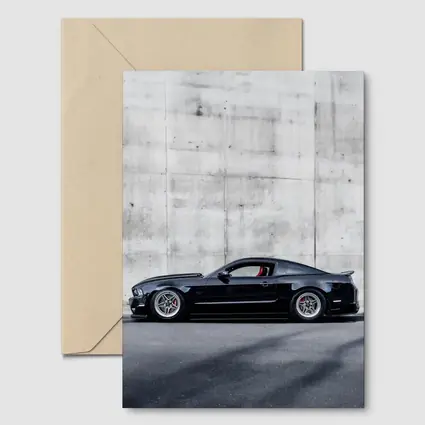Black Ford Mustang Against Concrete Wall