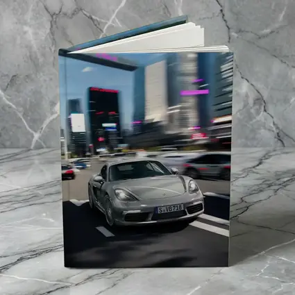 Porsche 718 Cayman Racing Through City Streets