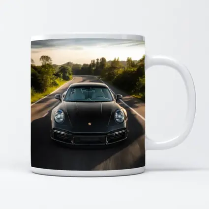 Black Porsche 911 Driving Open Road