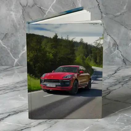Red Porsche Macan GTS On Forest Road