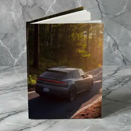 Porsche Macan Driving Through Sunlit Forest