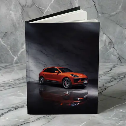 Porsche Macan Orange On Marble Background