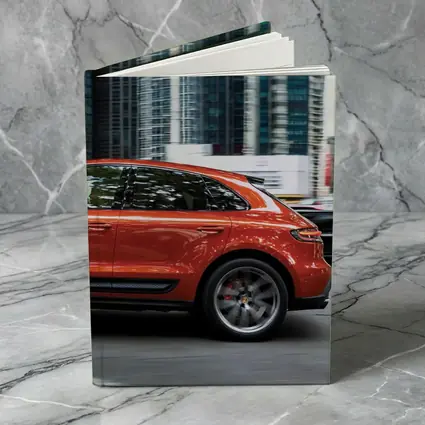 Porsche Macan S Orange City Skyscrapers