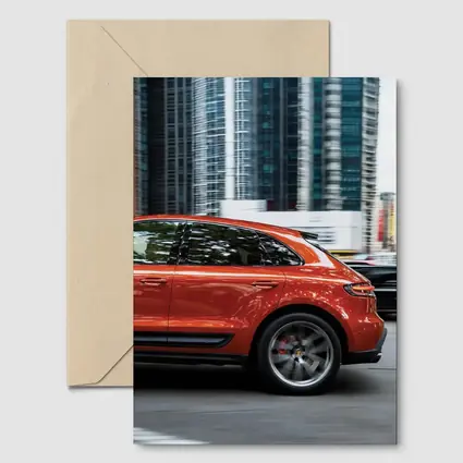 Porsche Macan S Orange City Skyscrapers