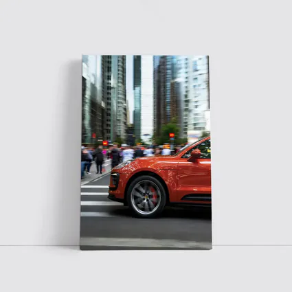 Porsche Macan Orange Speeding Through City Streets